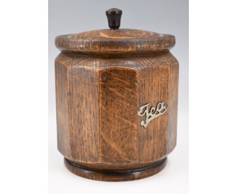A 1930s oak tea caddy, bearing an applied pierced label, 11 x 14 cm