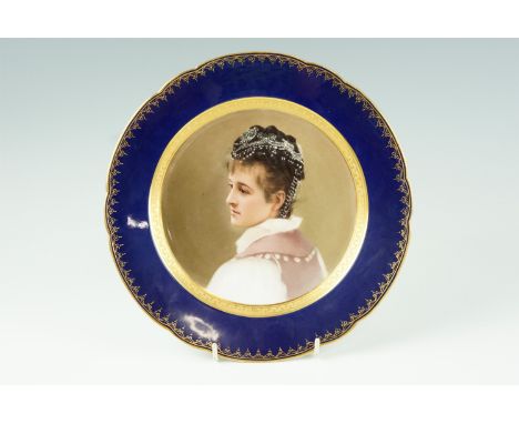 A portrait cabinet plate by Franz Xaver Thallmaier, portraying an Austrian woman wearing traditional black headdress, reserve