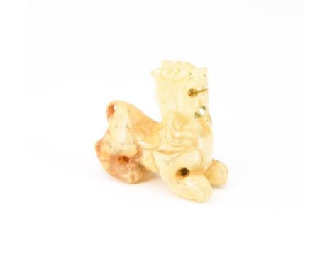 A small Chinese carved jade guardian lion, 2 cm