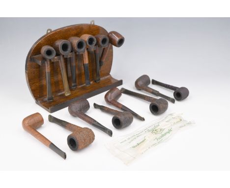 A quantity of tobacco pipes, including Orlik, Royal Comoys, Colonel Henry Fraser Lovat, etc, together with a pipe stand, circ