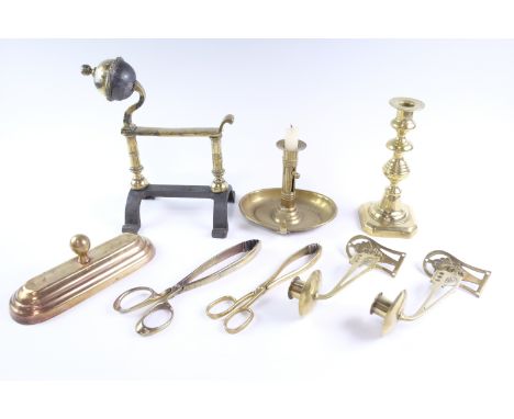 A pair of early 20th Century brass fireside tongs and a tool rest, a pair of brass piano sconce, a brass chamber stick, etc