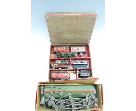 A boxed "The Hornby Clockwork Train", comprising a LMS locomotive, Sir Robert McAlpine &amp; Sons rotary tipping wagon, two t