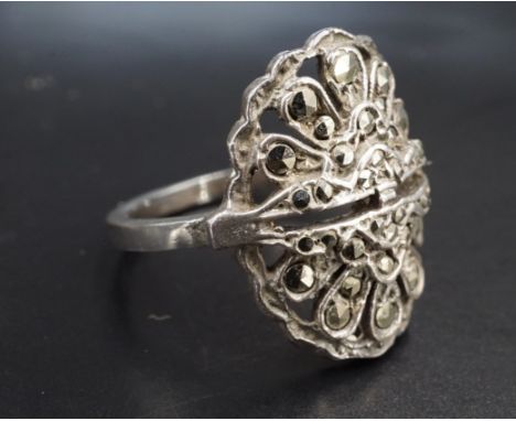 A vintage Art Deco style marcasite and white metal dress ring, stamped silver and tested as such, size M