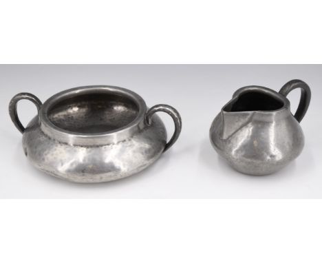 A Liberty Tudric pewter sugar basin and cream jug, early 20th Century