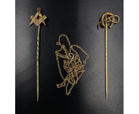 Two vintage yellow metal stick pins, being Masonic and equestrian, having a crop and a horseshoe, together with a fine curb l