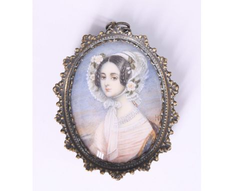 A mid 19th Century portrait miniature of a young lady in period costume and wearing a multi-strand pearl necklace, painted on