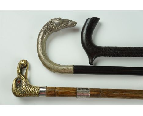 An Edwardian walking stick, having an electroplated crook handle modelled with a lurcher's head terminal on an ebony shaft, a