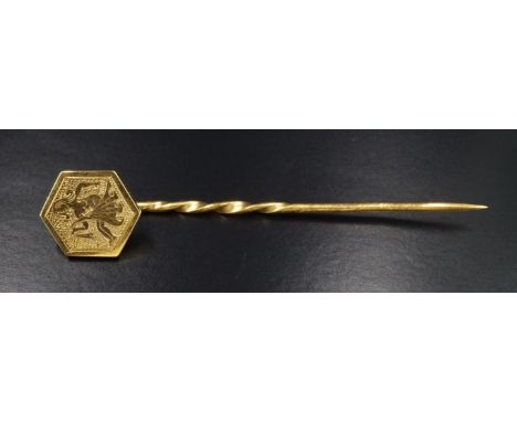 A mid 20th Century 9 ct yellow metal stick pin with engraved depiction of a bather, marked '9 ct', 1.79 g, 5.5 cm length