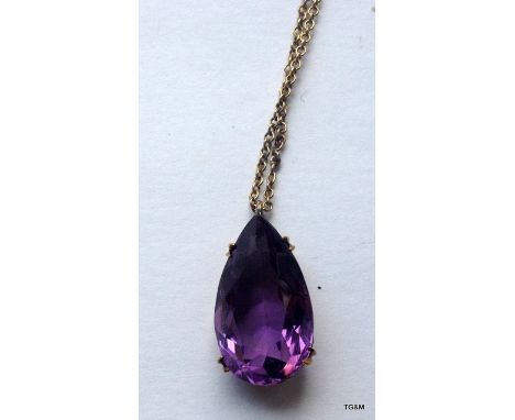 An Amethyst and gold pendant 
