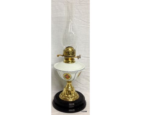 A Victorian oil lamp with china font 56cm high