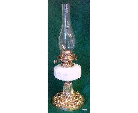 A Victorian oil lamp with Hinks Number 2 burner with ornate base 54cm high