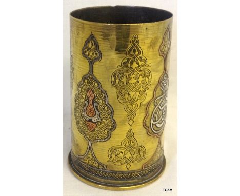 A superb trench art 5 inches high German shell casing inlaid with silver and copper and having Damascus October 1918 engraved