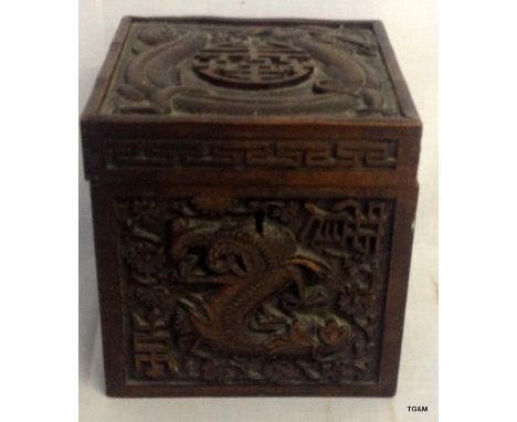 A Chinese rosewood tea caddy depicting dragons, 14.5cm tall x 14cm wide x 14cm deep 