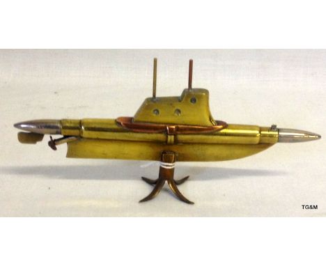 A trench art submarine 16 cms long made from two bullets with good detail including a spinning propeller
