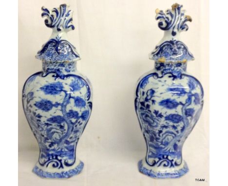 Pair of C18th Dutch Delft vases with ornate flame finial lids. 38cm high.