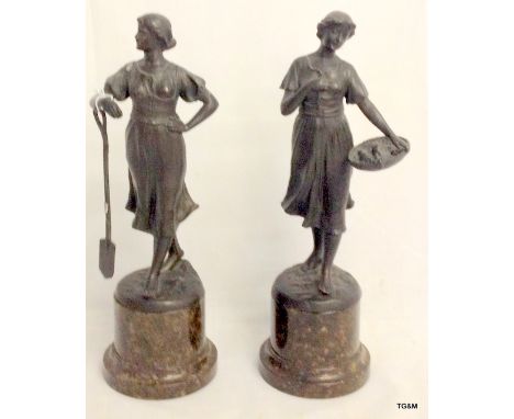 Pair of early C20th spelter figures of farm girls on serpentine marble bases.  29cm high.