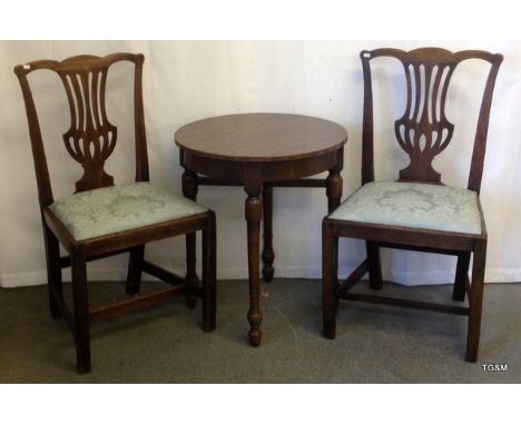A Pair of Georgian dining chairs and round lamp table