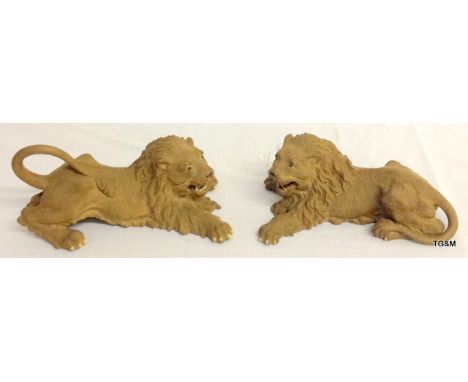 Pair of Chinese naturalistic Yixing pottery figures of lions.  