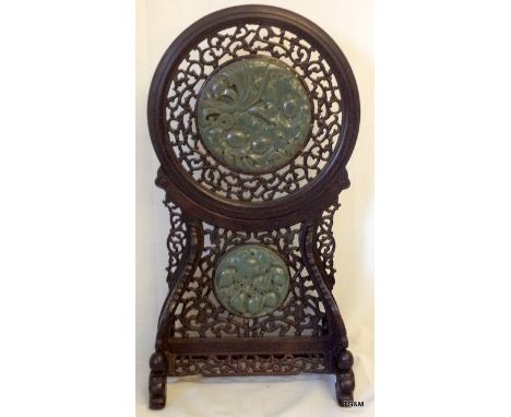 A carved and pierced Chinese table screen with inset carved Jade panels of turtles in foliage and peaches 45cm high