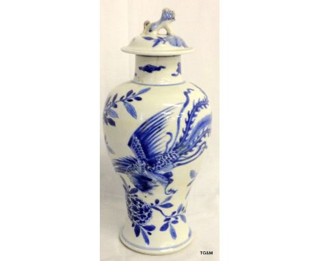 C17th Chinese blue and white baulster vase and lid, with Fo Dog finial and phoenix decoration.  27cm high.