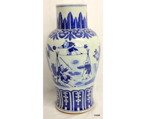 C19th blue and white vase with figures in continuous landscape.  40cm high.