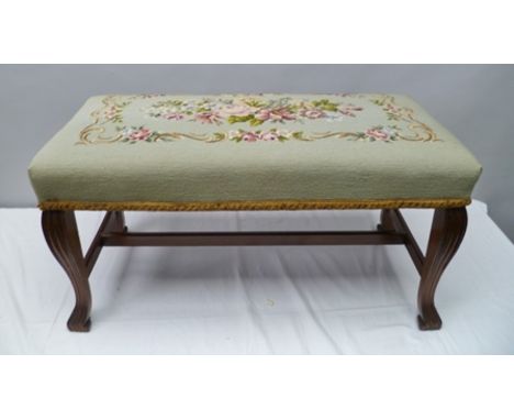 A GEORGIAN DESIGN DUET STOOL on fluted mahogany cabriole supports with "H" stretcher, floral tapestry upholstered seat on gre