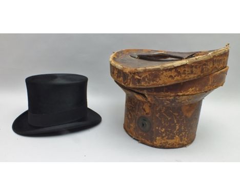A "TRESS & CO." SILK TOP HAT for "Lilly & Lilly of New Street", in a leather hat case 