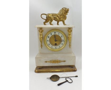 A 19TH CENTURY DESIGN MANTEL CLOCK, having alabaster case with gilt metal Lion mount, the dial with Arabic numerals, flanked 