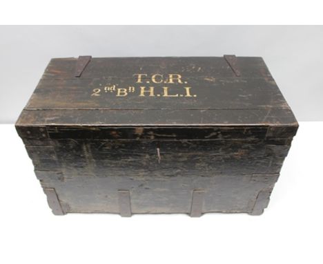 AN EARLY 20TH CENTURY PAINTED WOOD MILITARY STORAGE TRUNK fitted side carrying handles, the top inscribed "T.C.R. 2ND BN. HLI