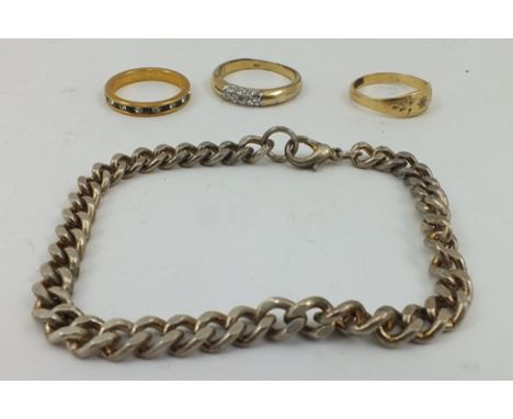 A GYPSY SET SOLITAIRE DIAMOND RING, yellow metal band, together with two costume rings and a chain bracelet (4) 