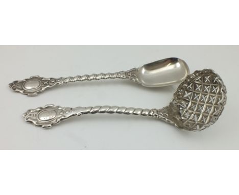 FRANCIS HIGGINS A SILVER SUGAR SPOON AND SUGAR CASTING LADLE, having ornate spiral twist handles with cast terminals, one cre