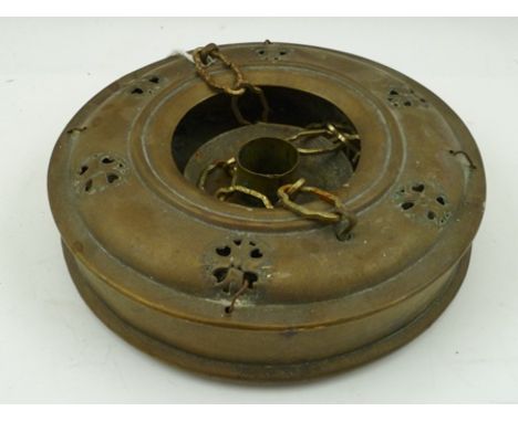 A CHINESE BRASS HANGING LANTERN of concertina form, closing down into a circular box, with central candle holder and chains, 