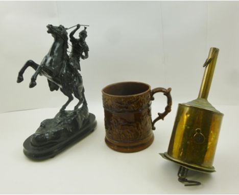 A LATE VICTORIAN EBONISED FIGURE OF A WARRIOR on a rearing horse, 30cm high, together with a treacle glazed hunting tankard a