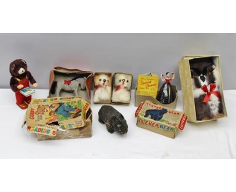 A COLLECTION OF MECHANICAL TOYS; "Cubby" The Reading Bear, with book and key, in original vendor's box, "Clever Bear" (no key