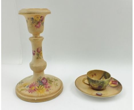 A ROYAL WORCESTER PORCELAIN CANDLESTICK, having floral painted decoration on a blush ivory ground, 16cm high, puce printed fa