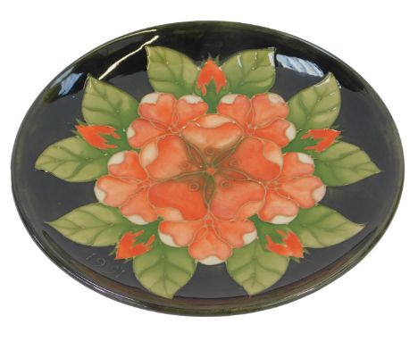 A Moorcroft pottery Tudor Rose pattern plate, 10th edition 1991, limited edition number 227/250, impressed marks and initiall