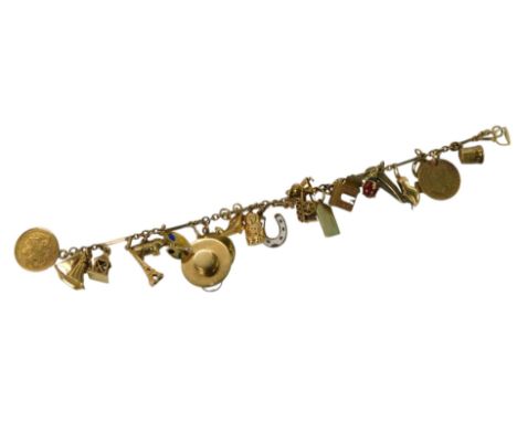 A charm bracelet, yellow metal, marked 9c, with twenty-one yellow metal charms, marked 375, 18ct, etc, to include a paint pal