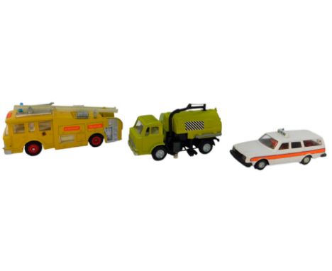 Dinky diecast vehicles, comprising a 449 Johnston road sweeper, a 283 airport fire rescue tender, and a 243 Volvo police car.