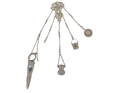 A Victorian silver chatelaine, decorated with a cherub, flowers, scrolls, etc., indistinctly hallmarked, together with four o