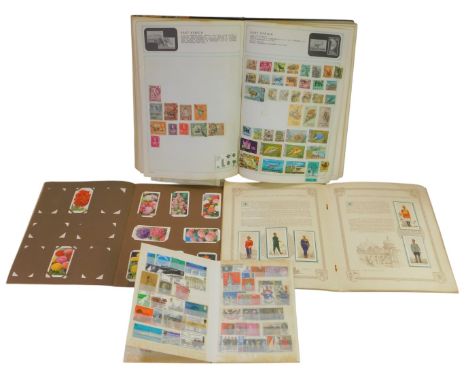 A Stanley Gibbons stamp album containing world and GB stamps, to include a Queen Victoria penny red, Silver Jubilee 1910-1935