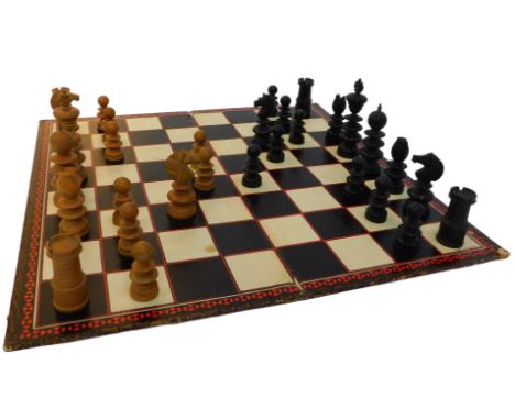 An ebony and boxwood chess set, height of King 10cm high, together with a chess and draughts board.