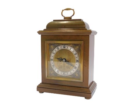 An Elliott mantel clock, the brass dial with silvered chapter ring bearing Roman numerals, cherubic spandrels, 22cm high.