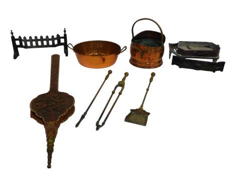 A group of fireside related items, including a copper coal bucket, with pressed ring handle, fire grate, a pair of carved oak