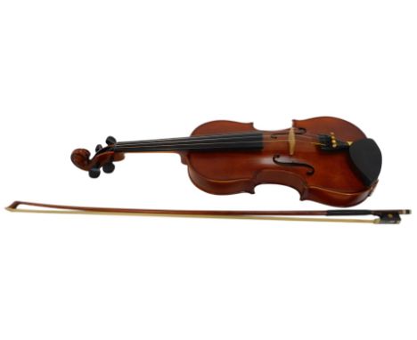 A Stentor Student II violin, one piece back, number M137698, 57cm long, with bow, in a hard case. 