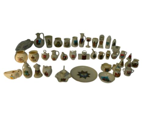A group of crested ware, to include a Carlton china British tank for Brighton, 16cm long, a longcase clock for Birkenhead, ot