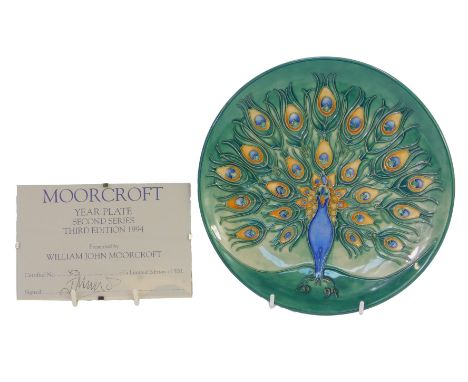 A Moorcroft pottery Peacock pattern plate, limited edition number 83/500, year stamp for 1994, impressed marks and initialled