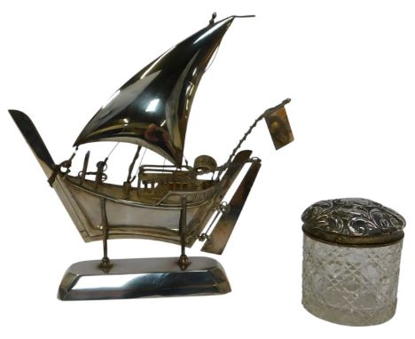 A Middle Eastern white metal model of a fishing boat, on stand, unmarked, 20cm high, together with a late Victorian cut glass