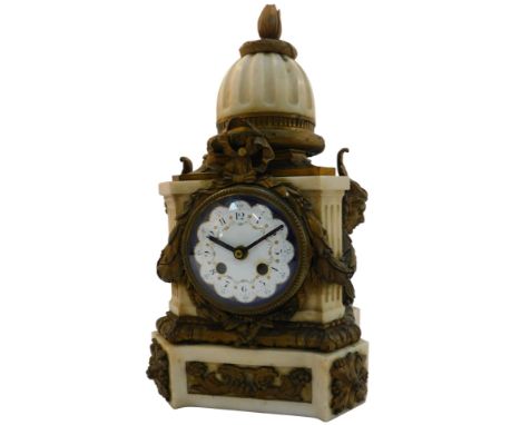 A 19thC French marble and brass mounted mantel clock, the circular white and blue enamel dial bearing Arabic numerals, with a