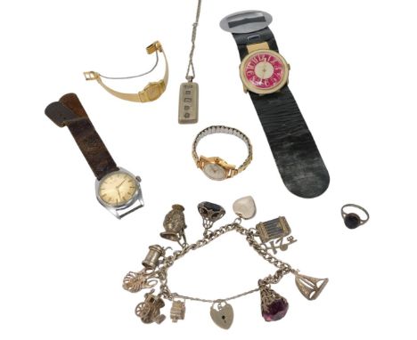A silver curb link charm bracelet, with a heart-shaped padlock clasp and safety chain as fitted, bearing various charms to in
