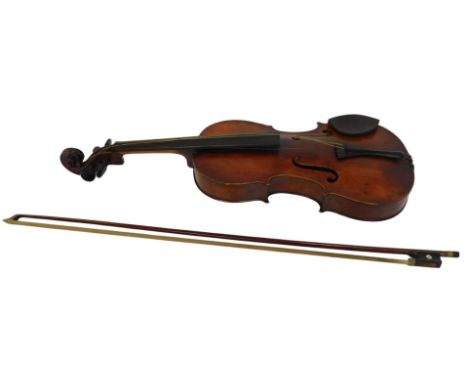 A violin, with a one piece back, 54cm long, together with a bow with mother of pearl inlay. 
